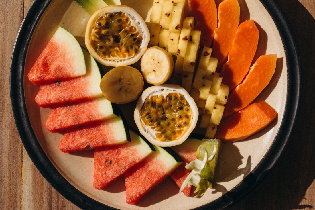 A fresh tropical fruit platter — watermelon, passion fruit, papaya and pineapple — at Lanka Yoga, Sri Lanka