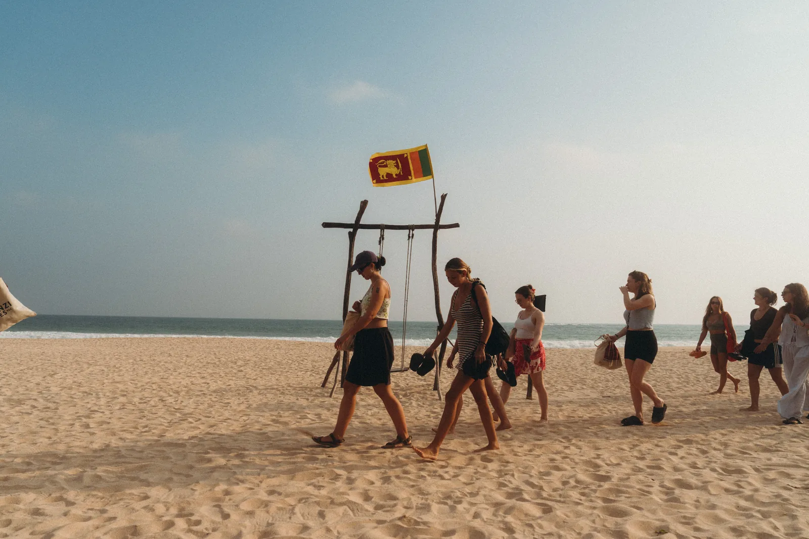 Beach yoga at sunset during a Lanka Yoga YTT in Sri Lanka